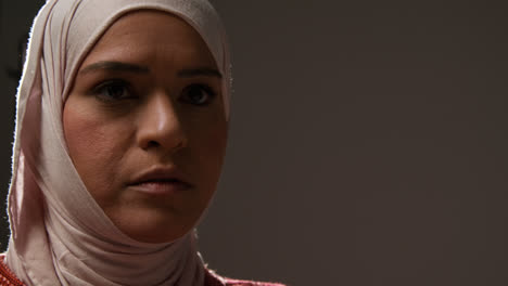Studio-Head-And-Shoulders-Portrait-Of-Muslim-Woman-Wearing-Hijab-Praying-7